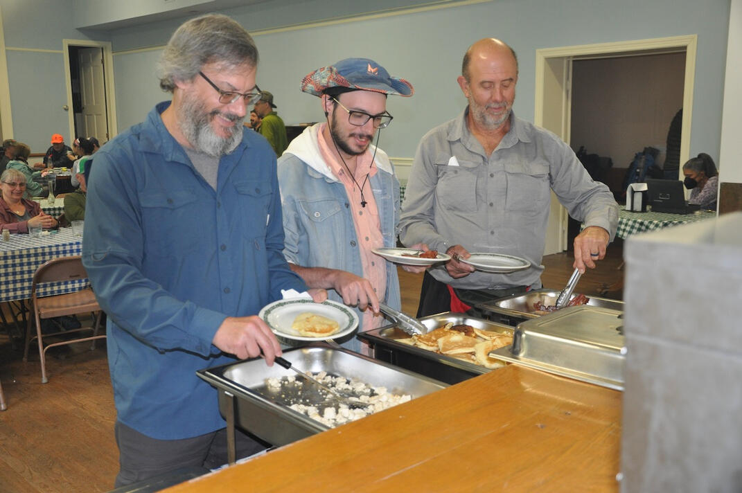Flip Floppers Enjoying Free Community Breakfast, Photo by Laurie Potteiger